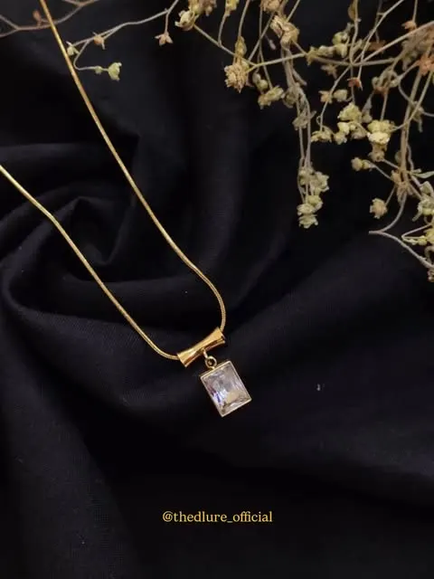 Blush crystal drop pendant on black velvet